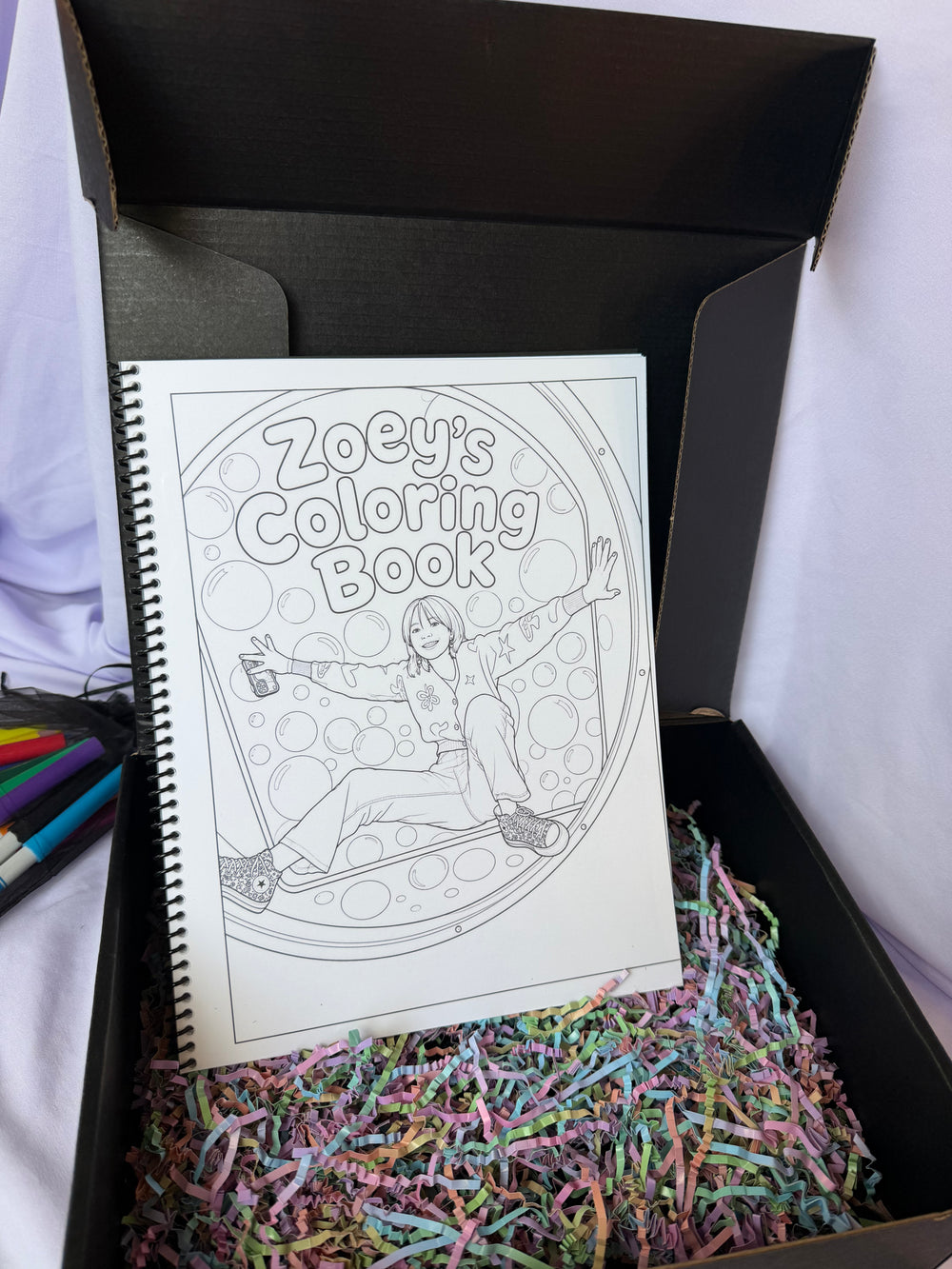 Personalized Zoey coloring book displayed in an open black keepsake gift box