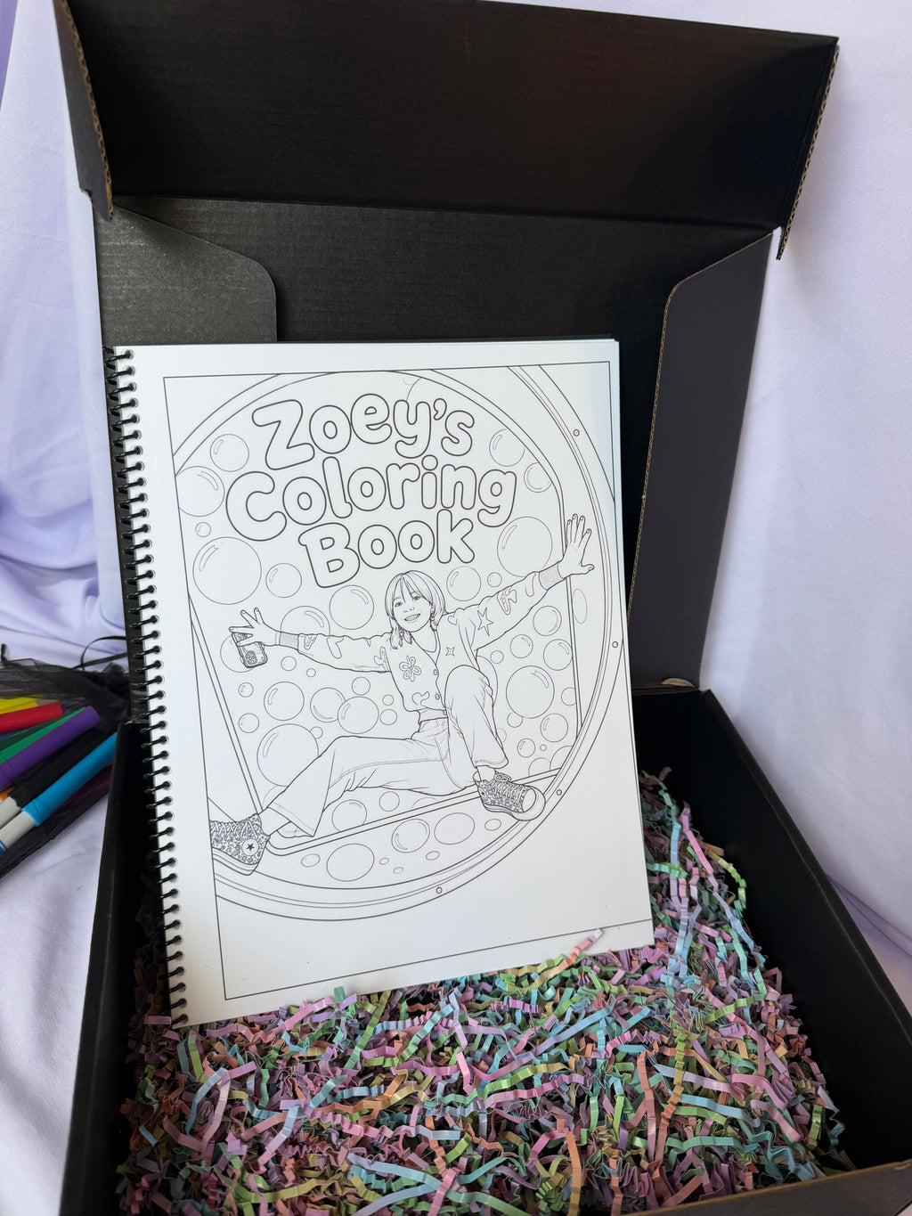 Personalized Zoey coloring book displayed in an open black keepsake gift box