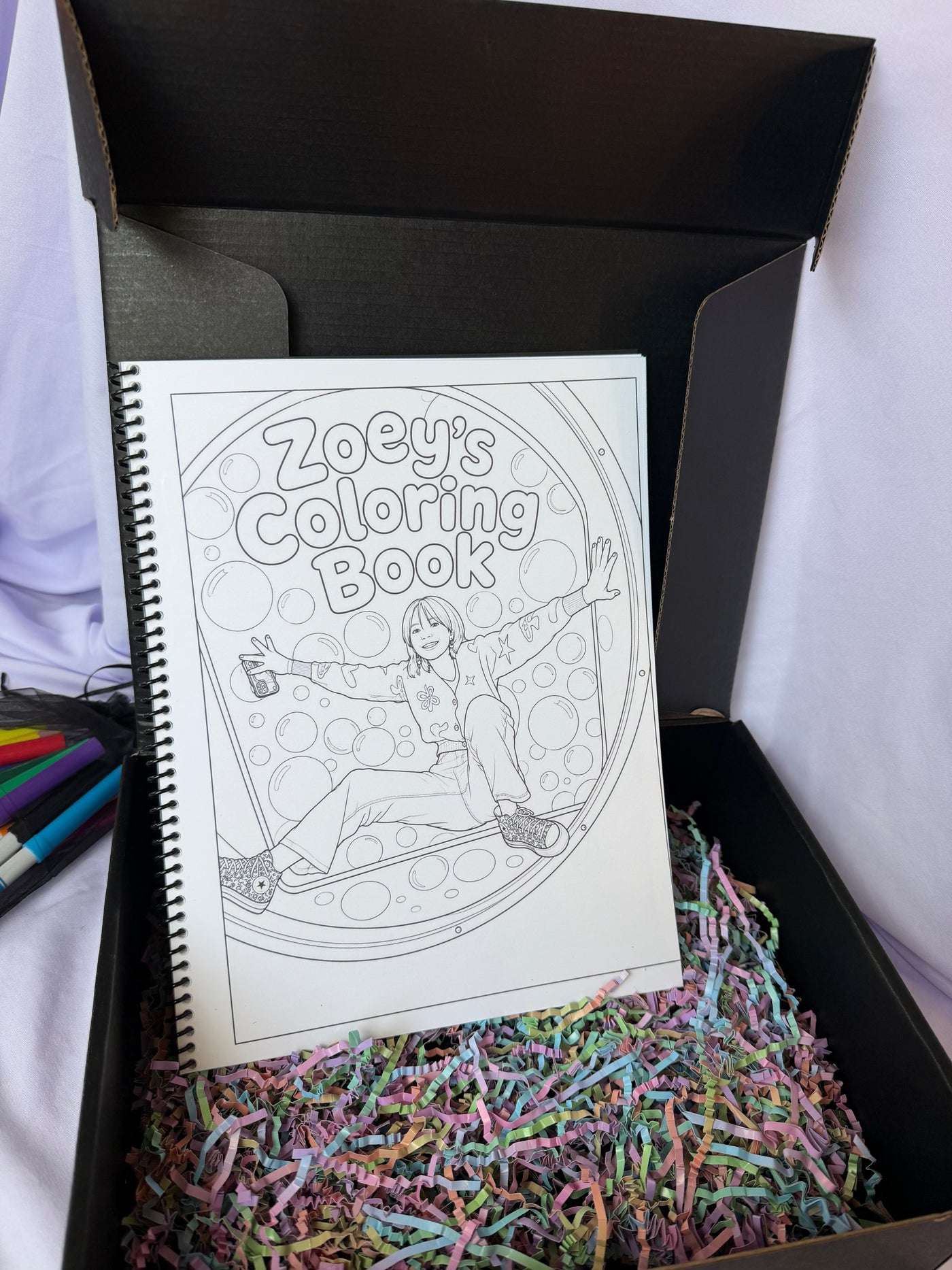 Personalized Zoey coloring book displayed in an open black keepsake gift box