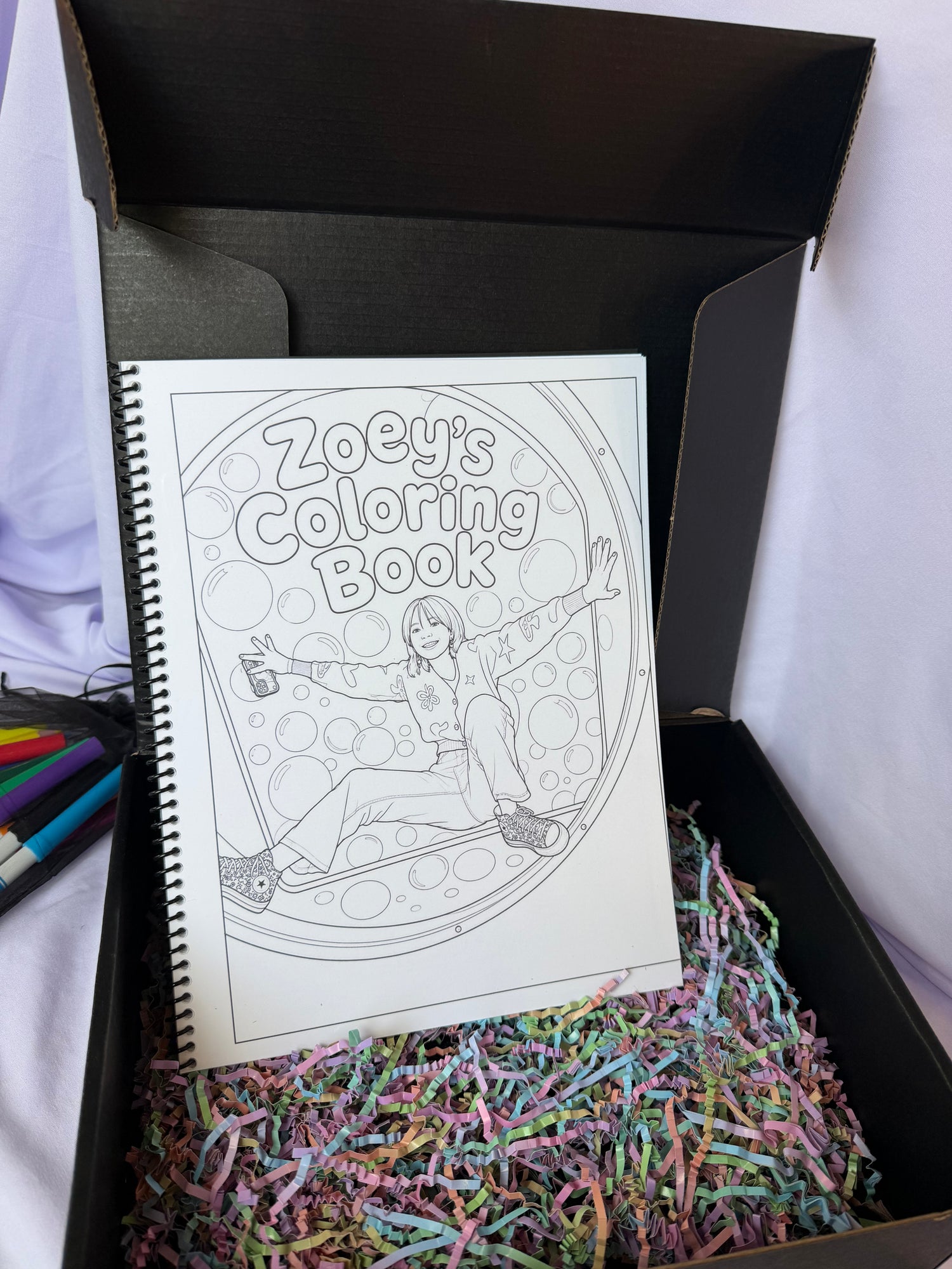 Personalized Zoey coloring book displayed in an open black keepsake gift box